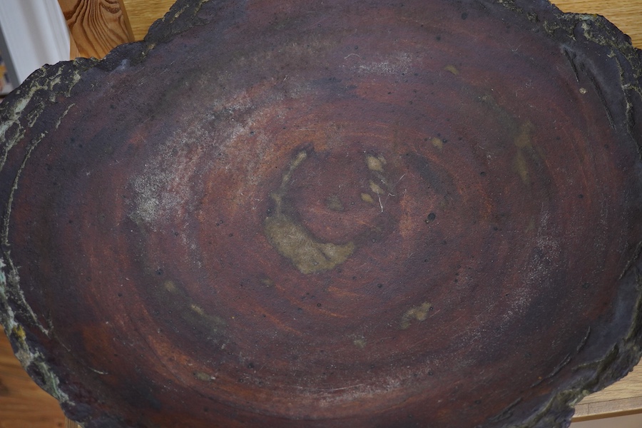 Dennis Fairweather, a large studio pottery flat dish with rough edges, 47cm wide